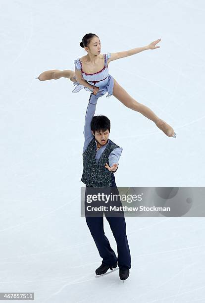 Narumi Takahashi and Kihara Ryuichi of Japan compete in the Figure Skating Team Pairs Free Skating during day one of the Sochi 2014 Winter Olympics...