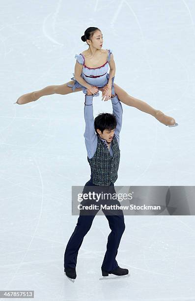 Narumi Takahashi and Kihara Ryuichi of Japan compete in the Figure Skating Team Pairs Free Skating during day one of the Sochi 2014 Winter Olympics...