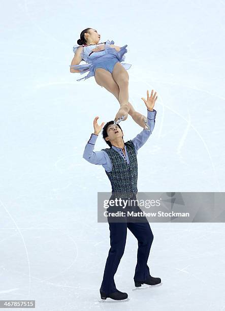 Narumi Takahashi and Kihara Ryuichi of Japan compete in the Figure Skating Team Pairs Free Skating during day one of the Sochi 2014 Winter Olympics...