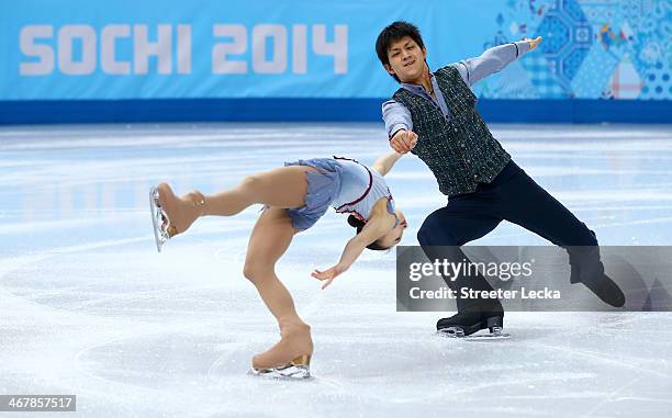 Narumi Takahashi and Kihara Ryuichi of Japan compete in the Figure Skating Team Pairs Free Skating during day one of the Sochi 2014 Winter Olympics...