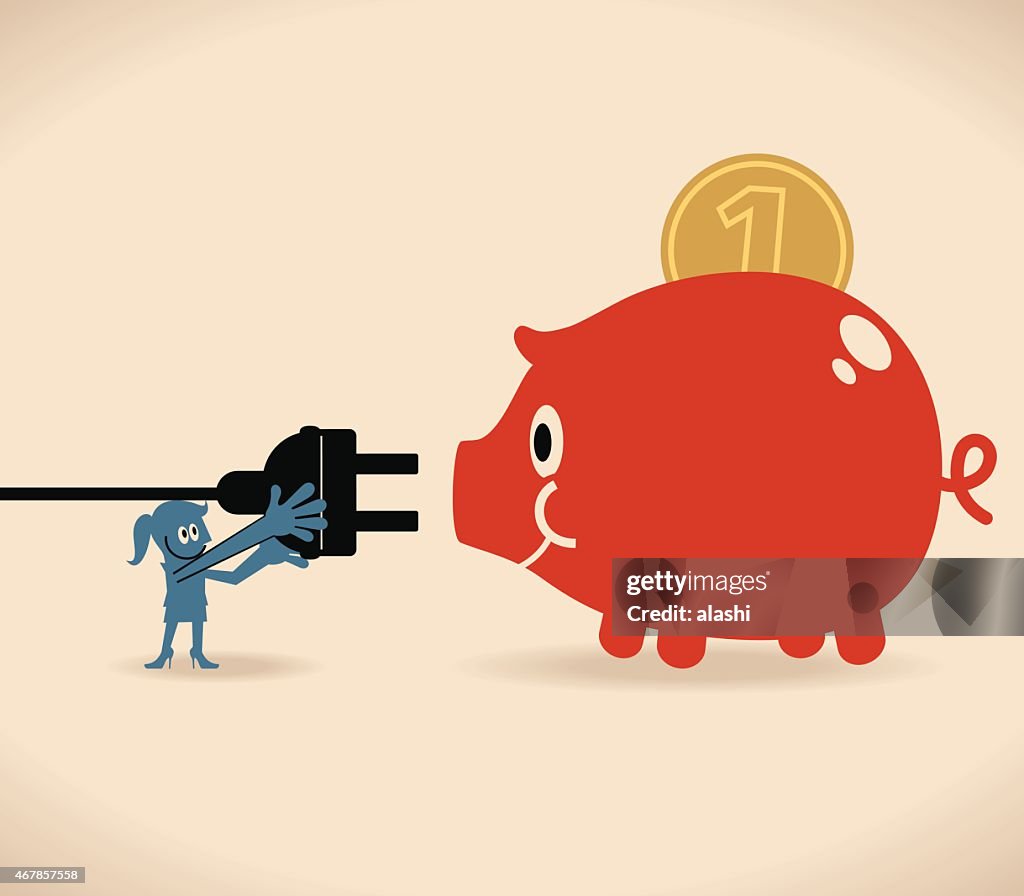 Smiling business women with large electric plug and piggy bank