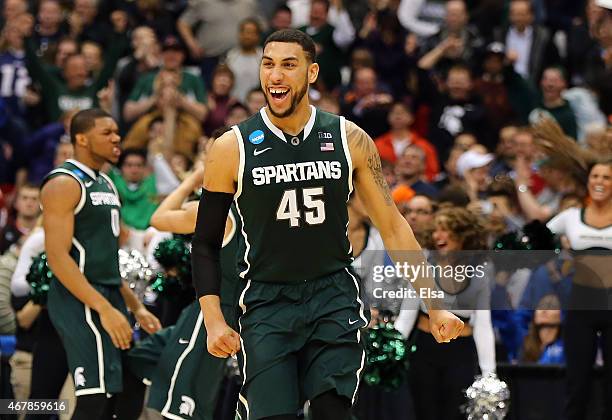 Denzel Valentine of the Michigan State Spartans celebrates after defeating the Oklahoma Sooners 62 to 58 during the East Regional Semifinal of the...