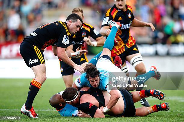 Mitchell Graham of the Chiefs is tackled during the round seven Super Rugby match between the Chiefs and the Cheetahs at Waikato Stadium on March 28,...