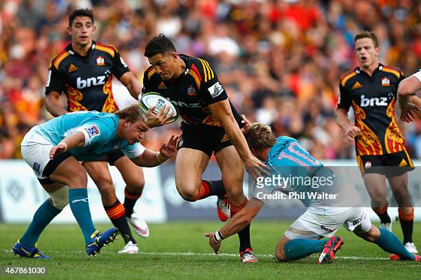 Sonny Bill Williams of the Chiefs makes a break during the round seven Super Rugby match between the Chiefs and the Cheetahs at Waikato Stadium on...