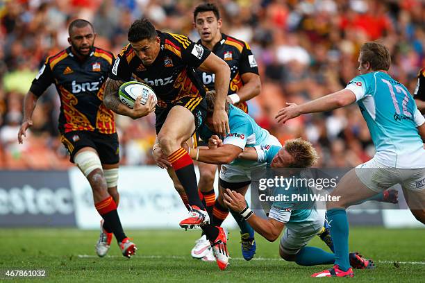 Sonny Bill Williams of the Chiefs makes a break during the round seven Super Rugby match between the Chiefs and the Cheetahs at Waikato Stadium on...