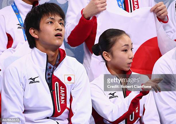 Narumi Takahashi and Kihara Ryuichi of Japan look on after competing in the Figure Skating Team Pairs Free Skating Program during day one of the...