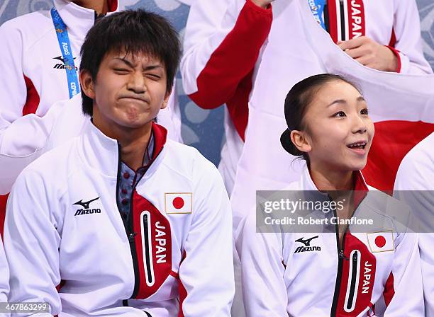 Narumi Takahashi and Kihara Ryuichi of Japan look on after competing in the Figure Skating Team Pairs Free Skating Program during day one of the...