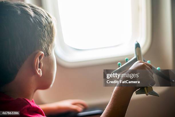 young boy playing with toy airplane - pretending to be a plane stock pictures, royalty-free photos & images