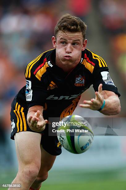 Brad Weber of the Chiefs offloads the ball during the round seven Super Rugby match between the Chiefs and the Cheetahs at Waikato Stadium on March...