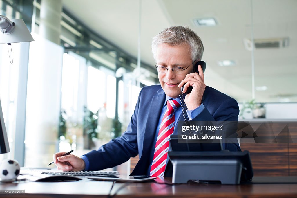 Businessman answering a phone call