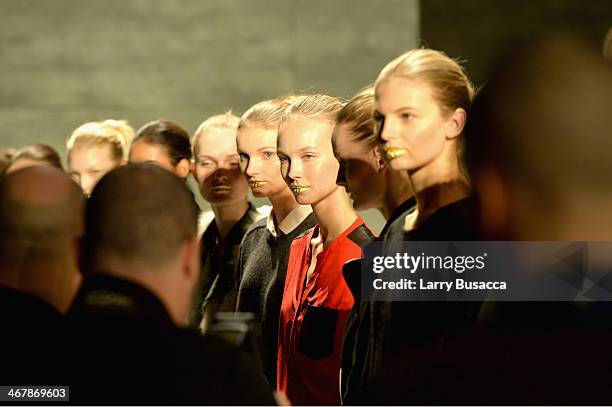 Models prepare backstage at the Son Jung Wan fashion show during Mercedes-Benz Fashion Week Fall 2014 at The Pavilion at Lincoln Center on February...