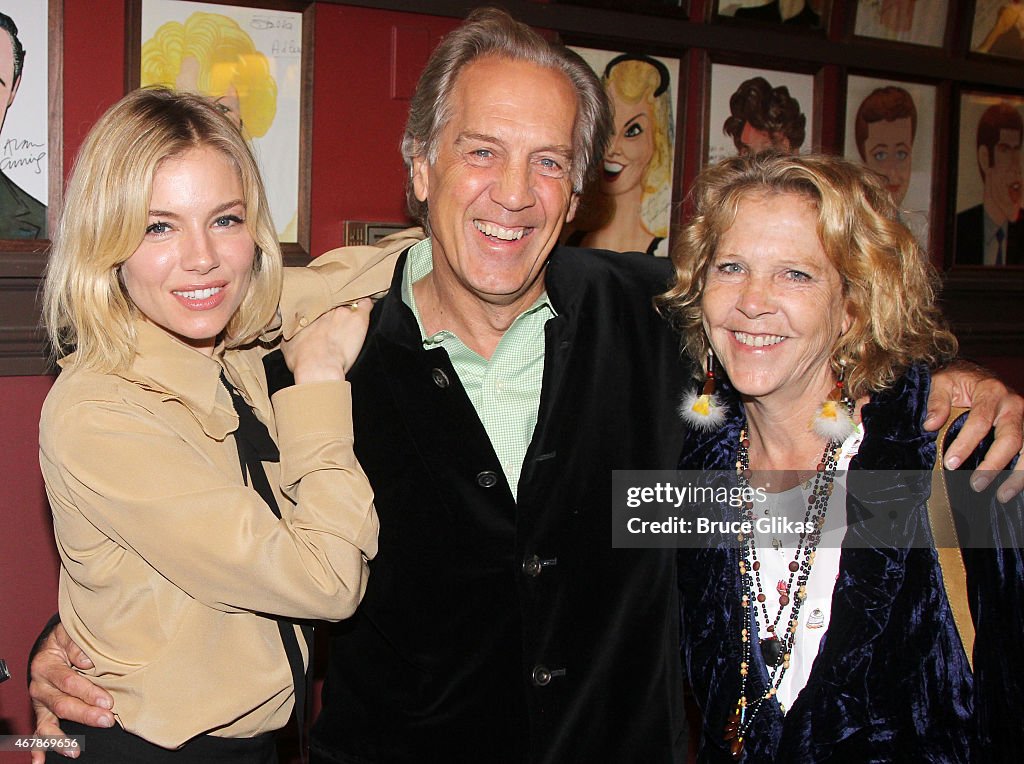 Sienna Miller, father Edwin Miller and wife June Miller pose as she