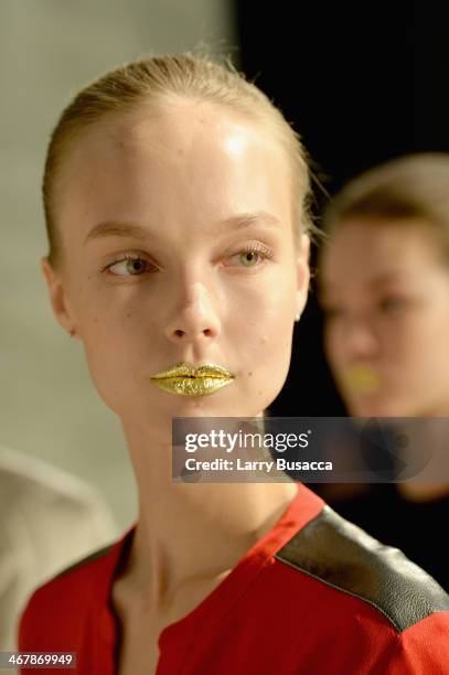 Model prepares backstage at the Son Jung Wan fashion show during Mercedes-Benz Fashion Week Fall 2014 at The Pavilion at Lincoln Center on February...