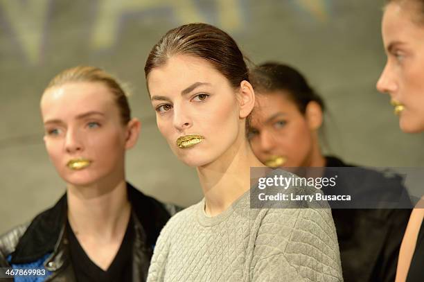 Model prepares backstage at the Son Jung Wan fashion show during Mercedes-Benz Fashion Week Fall 2014 at The Pavilion at Lincoln Center on February...