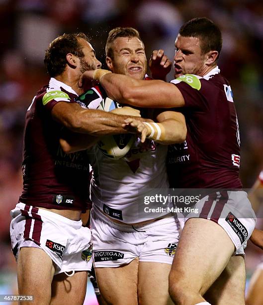 Trent Merrin of the Dragons is tackled during the round four NRL match between the St George Illawarra Dragons and the Manly Warringah Sea Eagles at...