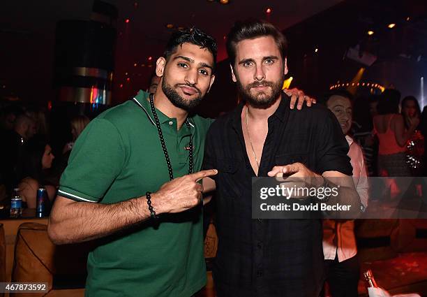 Boxer Amir Khan and television personality Scott Disick appear at 1 OAK Nightclub at The Mirage Hotel & Casino on March 27, 2015 in Las Vegas, Nevada.