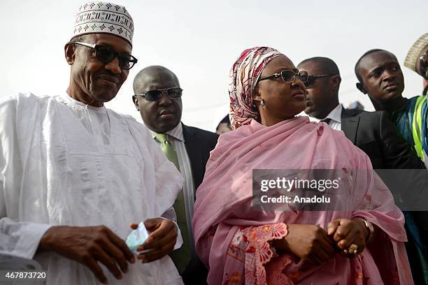 The main opposition All Progressives Congress presidential candidate, Mohammadu Buhari and his wife Aisha Halilu arrive for registration at Gidan...