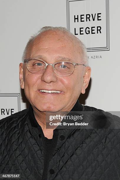 Designer Max Azaria poses backstage at the Herve Leger By Max Azria fashion show during Mercedes-Benz Fashion Week Fall 2014 at The Theatre at...