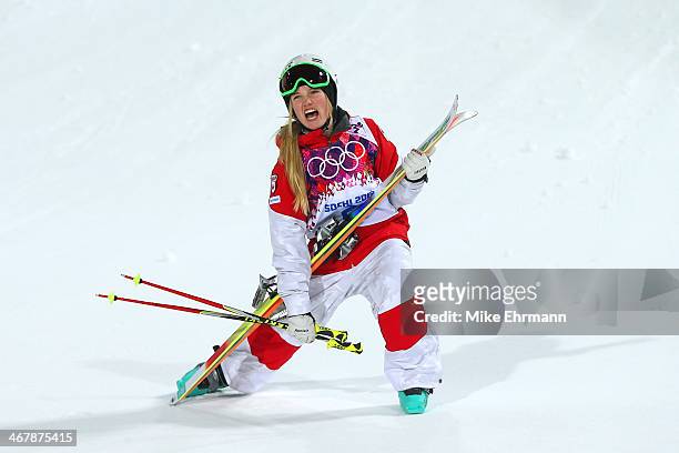 Justine Dufour-Lapointe of Canada celebrates winning gold in the Ladies' Moguls Final 3 on day one of the Sochi 2014 Winter Olympics at Rosa Khutor...