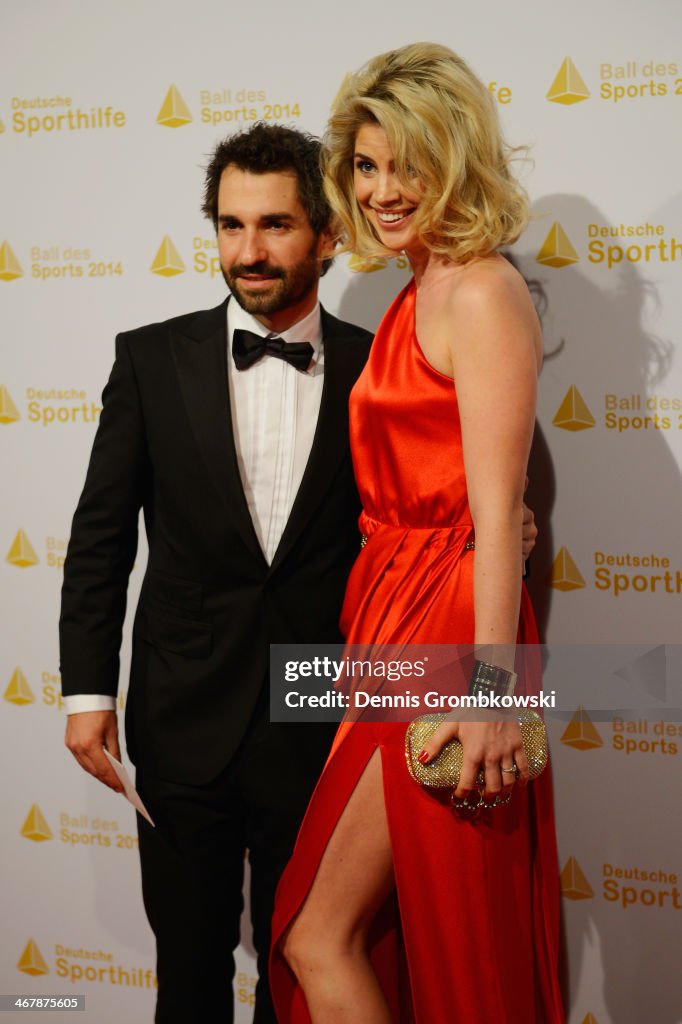 Isabell Ries Timo Glock poses with his partner Isabell Reis on his arrival at the ...