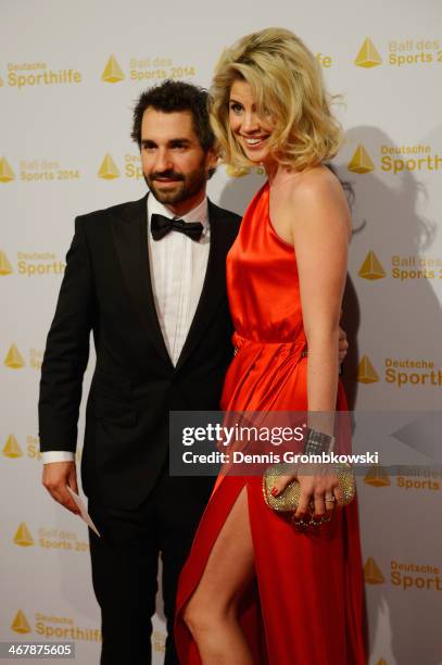 Timo Glock poses with his partner Isabell Reis on his arrival at the Ball des Sports 2014 at Rhein-Main-Halle on February 8, 2014 in Wiesbaden,...