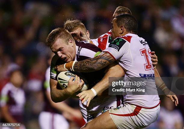 Jake Trbojevic of the Sea Eagles is tackled during the round four NRL match between the St George Illawarra Dragons and the Manly Warringah Sea...