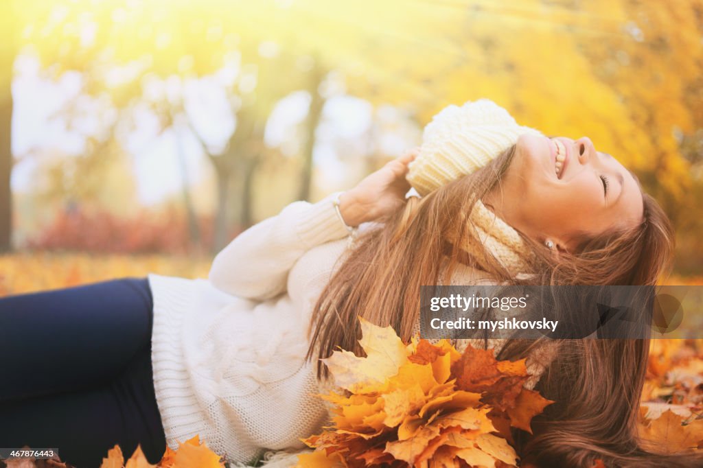 Attractive woman in autumn park