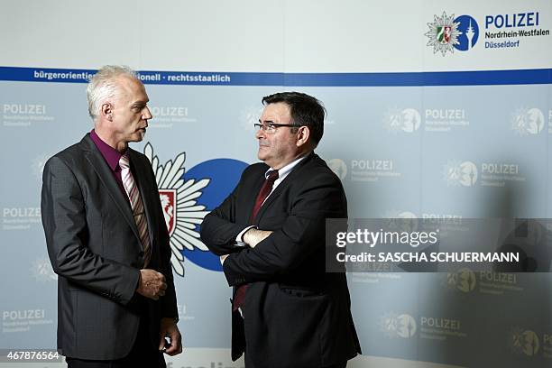 General Jean-Pierre Michel , head of the judicial police of the French gendarmerie, speaks with German Chief-Inspector Roland Wolff at the Police...