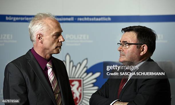 General Jean-Pierre Michel , head of the judicial police of the French gendarmerie, speaks with German Chief-Inspector Roland Wolff at the Police...