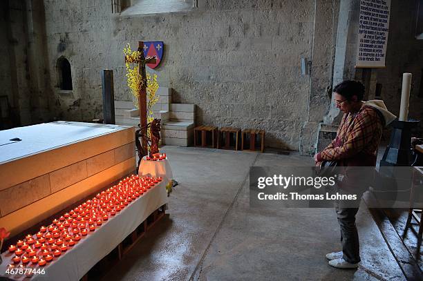 Woman remembers the victims of the Germanwings Airbus flight in a service at the 'Notre Dame du Bourg' cathedral on March 28, 2015 in...