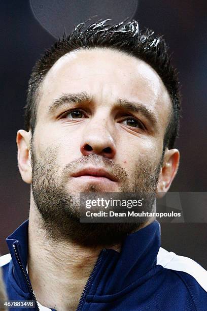 Mathieu Valbuena of France stands for the national anthem prior to the International Friendly match between France and Brazil at the Stade de France...