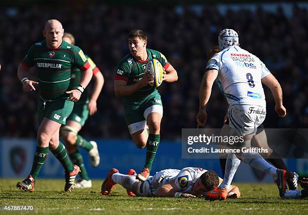 Ben Youngs of Leicester Tigers dances through the Exeter tackles during the Aviva Premiership match between Leicester Tigers and Exeter Chiefs at...