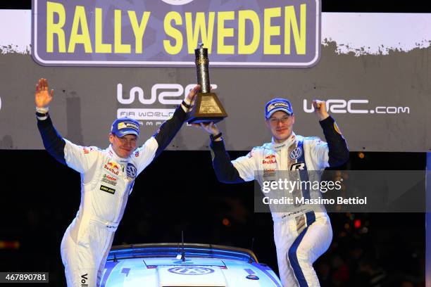 Jari Matti Latvala of Finland and Mikka Anttila of Finland celebrate their victory in the final podium during Day Three of the WRC Sweden on February...