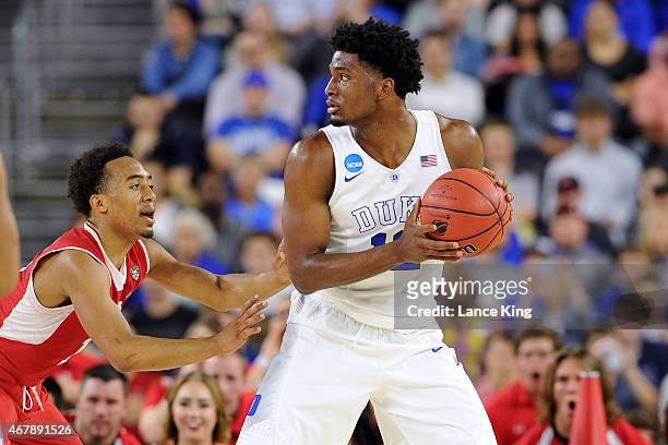 Justise Winslow of the Duke Blue Devils works on offense against Brandon Taylor of the Utah Utes during the South Regional Semifinal round of the...