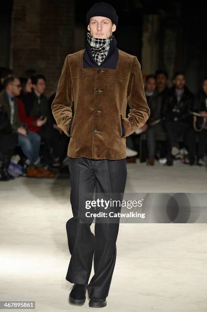 Model walks the runway at the N.Hoolywood Autumn Winter 2014 fashion show during New York Fashion Week on February 7, 2014 in New York, United States.