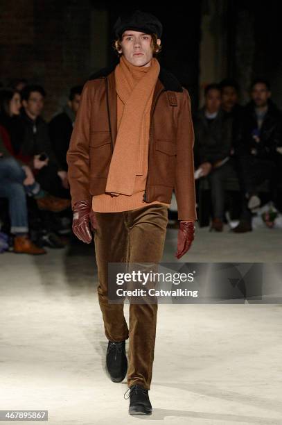 Model walks the runway at the N.Hoolywood Autumn Winter 2014 fashion show during New York Fashion Week on February 7, 2014 in New York, United States.