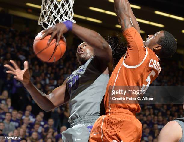 Forward D.J. Johnson of the Kansas State Wildcats grabs a rebound against guard Damarcus Crocker of the Texas Longhorns during the second half on...
