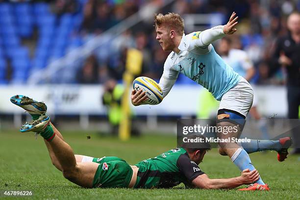 Chris Harris of Newcastle Falcons is held up by Tom Fowlie of London Irish during the Aviva Premiership match between London Irish and Newcastle...