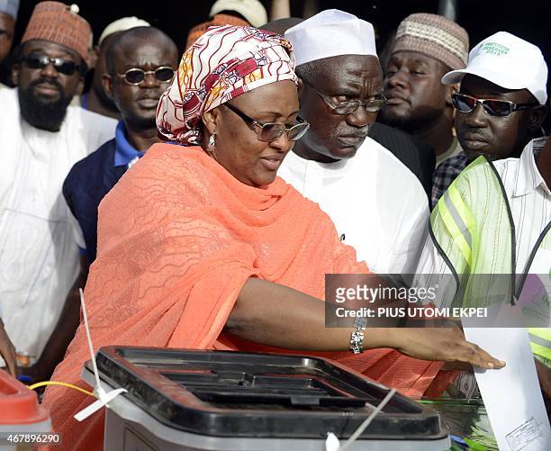 Main opposition All Progressives Congress presidential candidate Mohammadu Buhari's wife, Aisha casts her ballot at a polling station in the "Gidan...