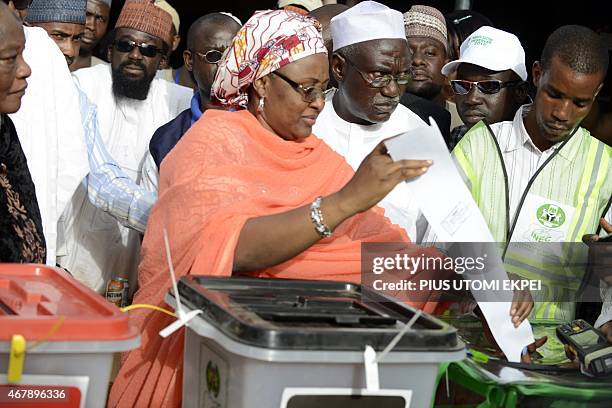 Main opposition All Progressives Congress presidential candidate Mohammadu Buhari's wife, Aisha casts her ballot at a polling station in the "Gidan...