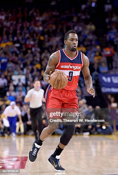 Martell Webster of the Washington Wizards dribbles the ball up court against the Golden State Warriors at ORACLE Arena on March 23, 2015 in Oakland,...