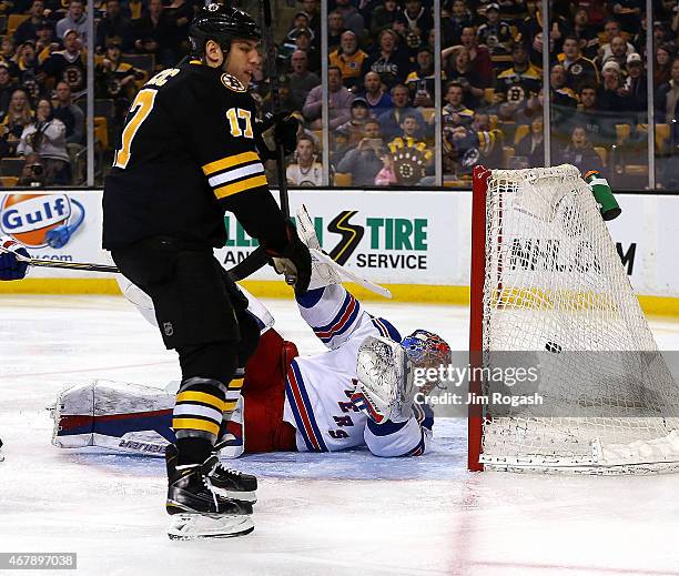 Henrik Lundqvist of the New York Rangers allows a goal by Milan Lucic of the Boston Bruins in the first period at the TD Garden on March 28, 2015 in...