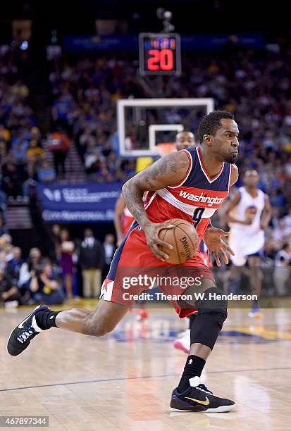 Martell Webster of the Washington Wizards drives towards the basket against the Golden State Warriors at ORACLE Arena on March 23, 2015 in Oakland,...