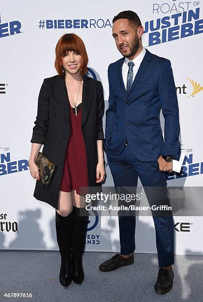 Singer Carly Rae Jepsen and guest arrive at the Comedy Central Roast of Justin Bieber on March 14, 2015 in Los Angeles, California.