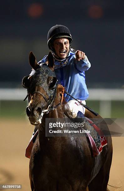 William Buick celebrates riding Prince Bishop to victory in the Dubai World Cup at the Meydan Racecourse on March 28, 2015 in Dubai, United Arab...