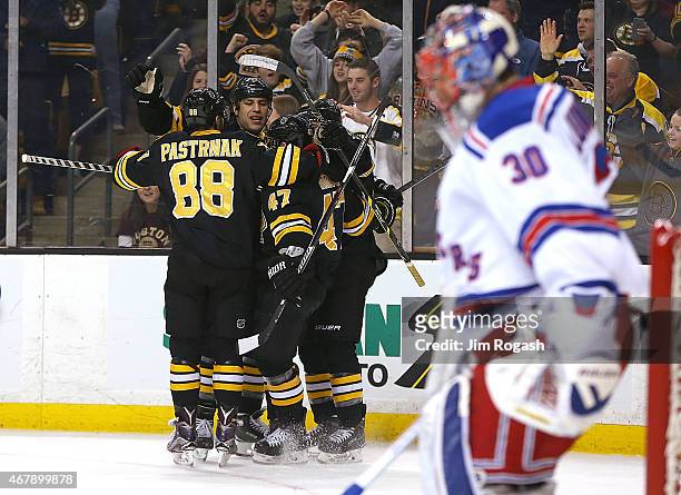 Milan Lucic of the Boston Bruins celebrates hits second goal against Henrik Lundqvist of the New York Rangers in the first period at the TD Garden on...