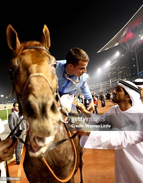 William Buick is congratulated by Hamdan bin Mohammed bin Rashid Al Maktoum, Crown Prince of Dubai after winning the Dubai World Cup on Prince Bishop...