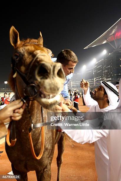 William Buick is congratulated by Hamdan bin Mohammed bin Rashid Al Maktoum, Crown Prince of Dubai after winning the Dubai World Cup on Prince Bishop...