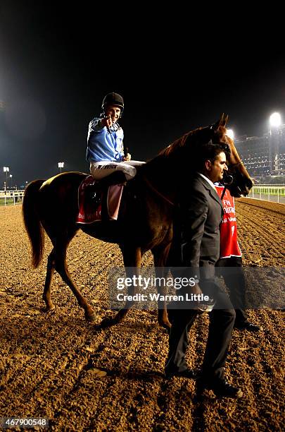 William Buick celebrates riding Prince Bishop to victory in the Dubai World Cup at the Meydan Racecourse on March 28, 2015 in Dubai, United Arab...