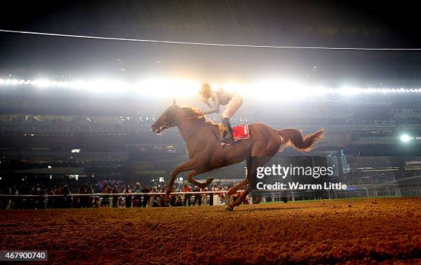 William Buick celebrates riding Prince Bishop to victory in the Dubai World Cup at the Meydan Racecourse on March 28, 2015 in Dubai, United Arab...